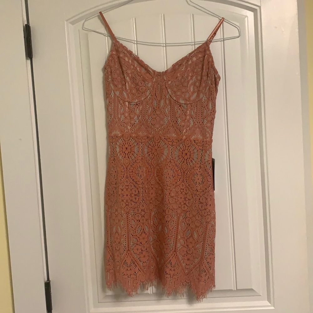 Lace blush mini dress with bust detail